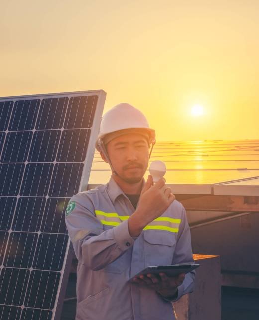 Engineer solar photovoltaic panels station checks with tablet computer. Energy technology concept